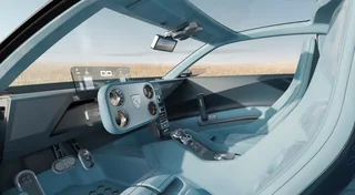 Interior del Peugeot RCZ Vision con asientos azul claro, techo panorámico, mandos Hypersquare y pantalla transparente sobre el salpicadero.
